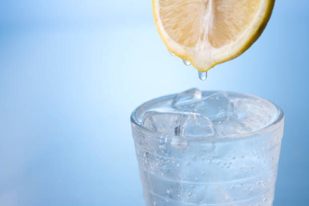 istock Glass of ice water with lemon 871967036