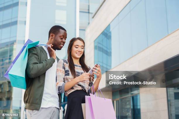 Multiethnic Couple Shopping Together Stock Photo - Download Image Now - Retail, Couple - Relationship, Happiness