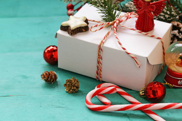 istock turquoise background with christmas symbols and ornaments 871977082