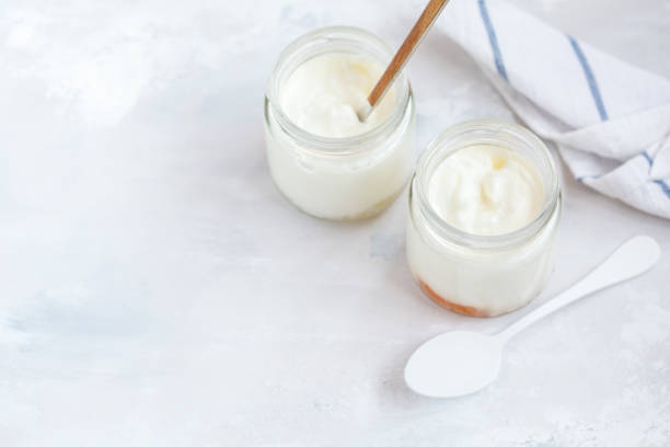istock Homemade fruit yogurt in a glass jar 871980618