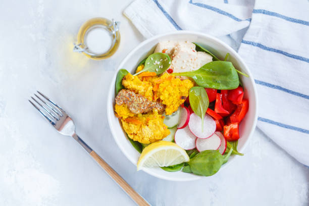 istock Vegan food: an open lentil burger with tofu and vegetables. 871981058