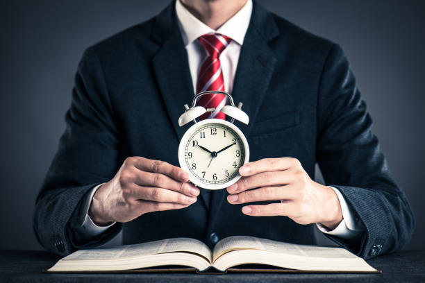 istock Businessman and alarm clock,studio shooting 871981102