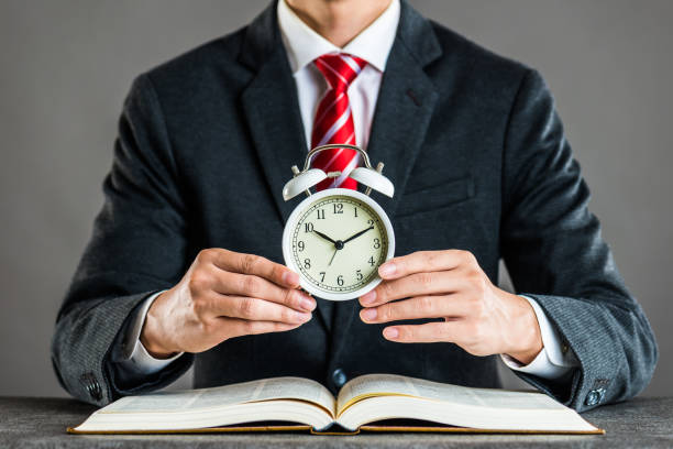 istock Businessman and alarm clock,studio shooting 871983834
