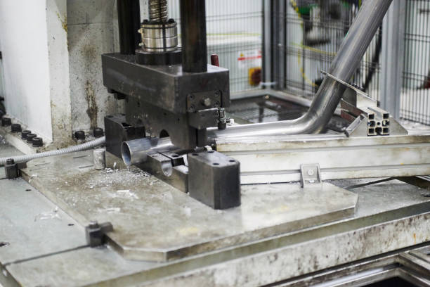 istock Robot bending pipe in modern factory 871983938
