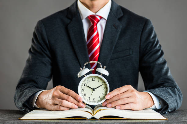 istock Businessman and alarm clock,studio shooting 871984588