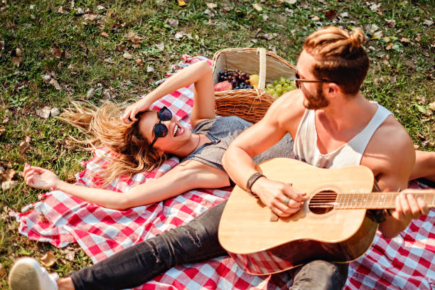 Man playing guitar to his girl