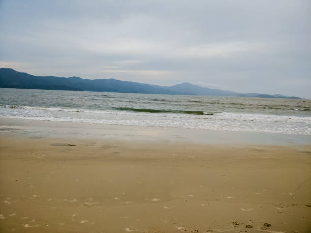 istock Bach sand space cloudy day sea 871985440