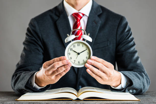 istock Businessman and alarm clock,studio shooting 871986592
