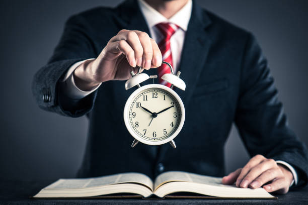 istock Businessman and alarm clock,studio shooting 871989290