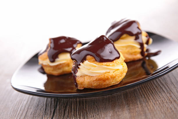 istock profiterole, french puff pastry with cream and chocolate 871990100