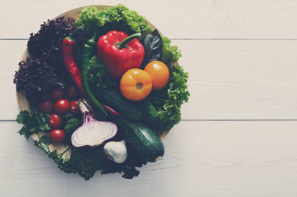 istock Border of fresh vegetables on wooden background with copy space 871996552