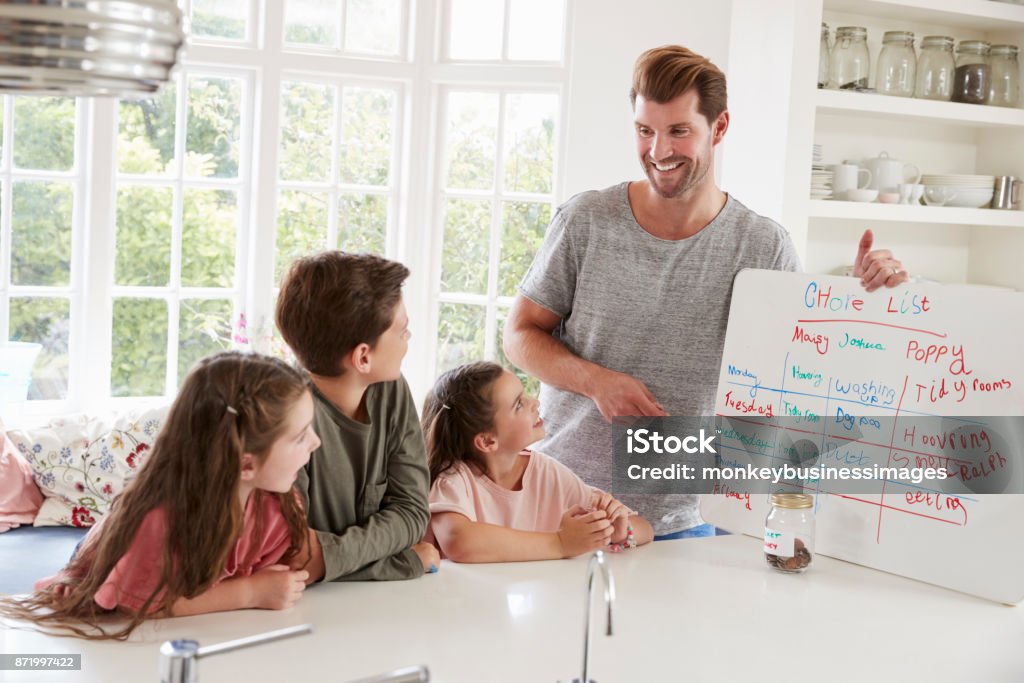 Children Receiving Pocket Money After Completing List Of Chores Chores Stock Photo