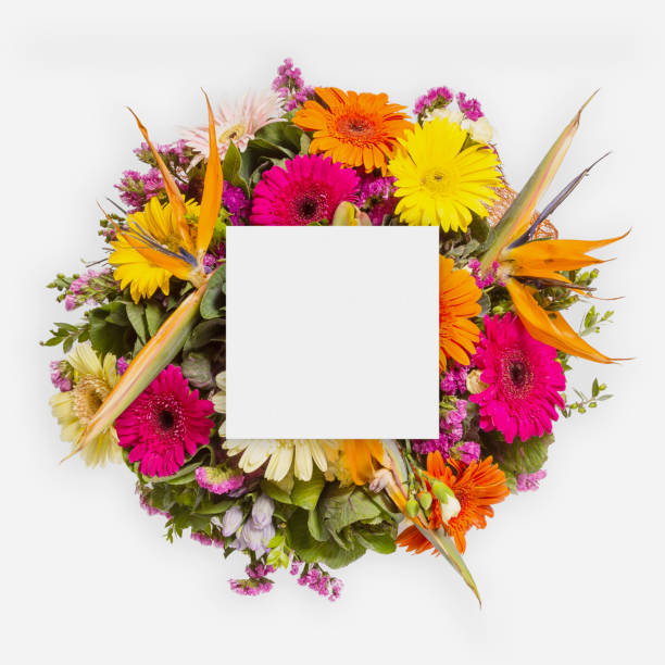 istock Creative layout made of flowers and leaves with paper card note. Flat lay 871999794