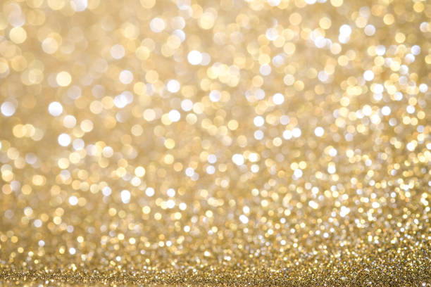 istock Gold Abstract Christmas twinkled bright background with bokeh defocused lights . Lights Festive background concept. 872001102