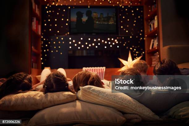 Family Enjoying Movie Night At Home Together Stock Photo - Download Image Now - Movie, Night, Family