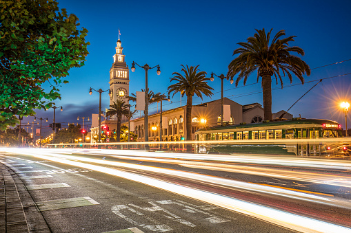 Long exposure image of traffic at night in front San Francisco Ferry Building.