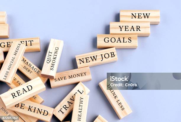 New Years Resolutions Written On Wood Blocks Stock Photo - Download Image Now - New Year Resolution, Achievement, Aiming