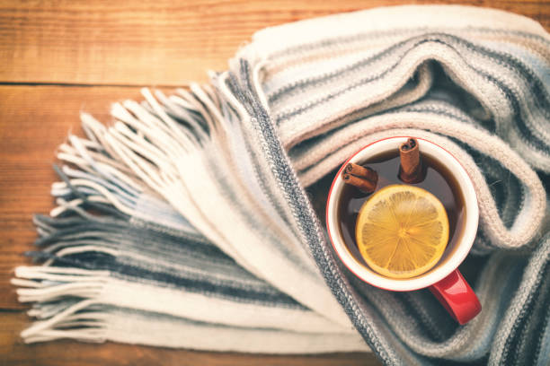 istock A cup of hot tea is wrapped in a scarf. 872018020