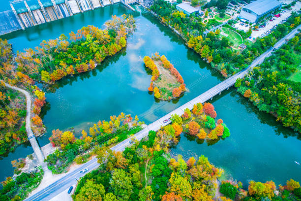 istock Fall comes to Austin Texas high view way above Fall comes to Austin Texas straight down view of circle pattern parking at Red Bud Island fall foliage along the nature landscape 872025534