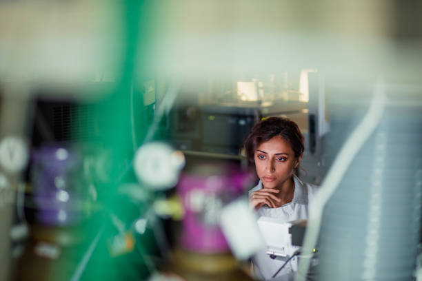 Female Laboratory Research Analyst Patient personal health care taken by a specialist biochemist in a London research facility medical technical equipment photos stock pictures, royalty-free photos & images
