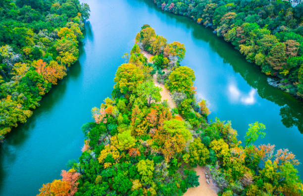 istock Fall comes to Austin Texas above peninsula point at Red Bud Isle autumn landscape 872025980