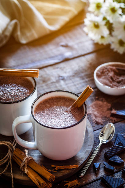 istock Two homemade hot chocolate mugs on rustic wooden table 872026688