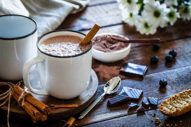 istock Two homemade hot chocolate mugs on rustic wooden table 872026888