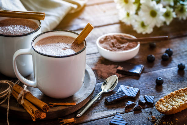 istock Two homemade hot chocolate mugs on rustic wooden table 872026926