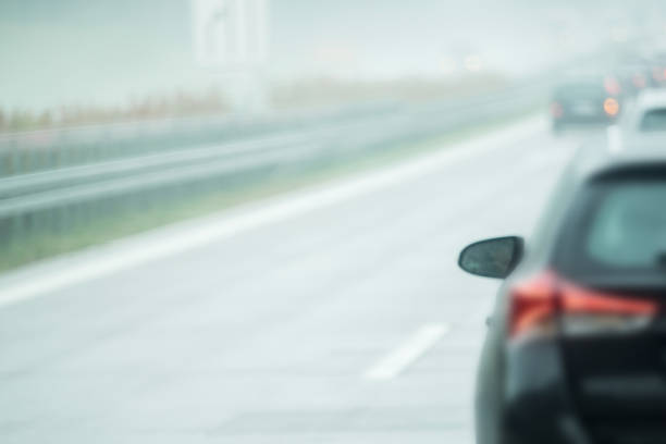 istock A car is driving on the road in the rain 872032870