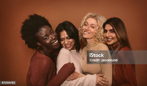 Group Of Cheerful Young Women Standing Together Stock Photo - Download Image Now - Women, Only Women, Multiracial Group