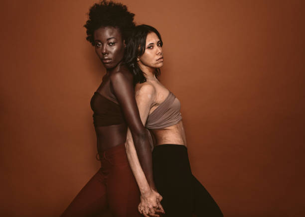 istock Two diverse woman standing together 872036786