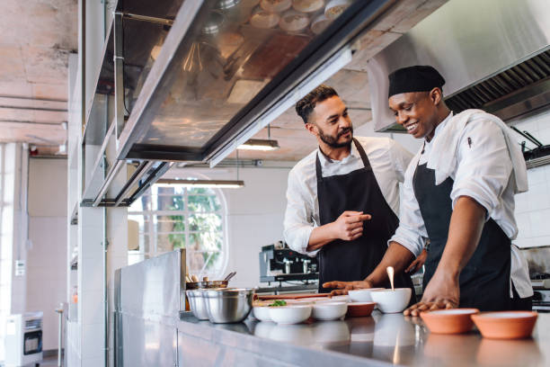 istock Chefs cooking food at cafe kitchen 872037256