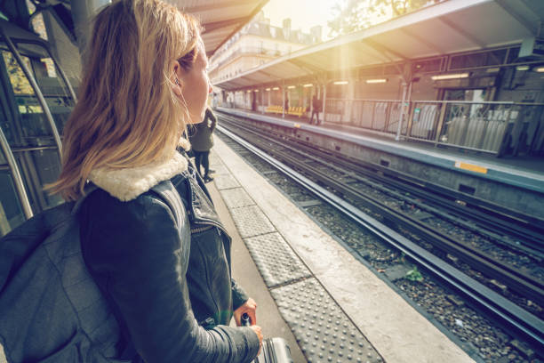 istock Young woman waiting for metro in Paris 872042842
