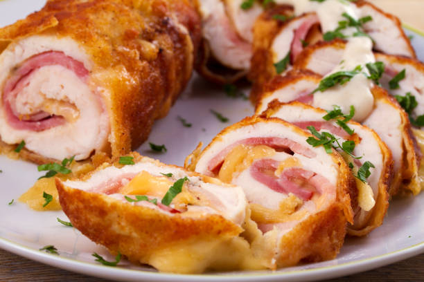 istock Chicken breasts with cheese and bacon. Crispy, creamy chicken wraps 872047758