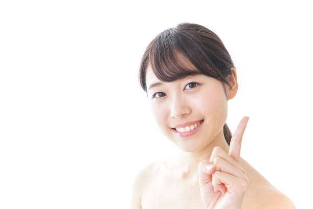 istock Young woman pointing 872047924