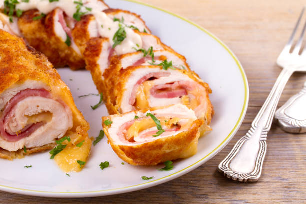 istock Chicken breasts with cheese and bacon. Crispy, creamy chicken wraps 872048672