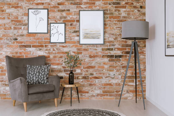 istock Gray furniture against brick wall 872049484