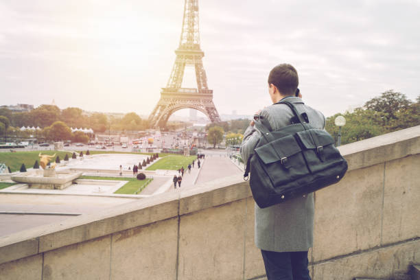 istock Business travel man on the phone in Paris, Eiffel Tower 872050794