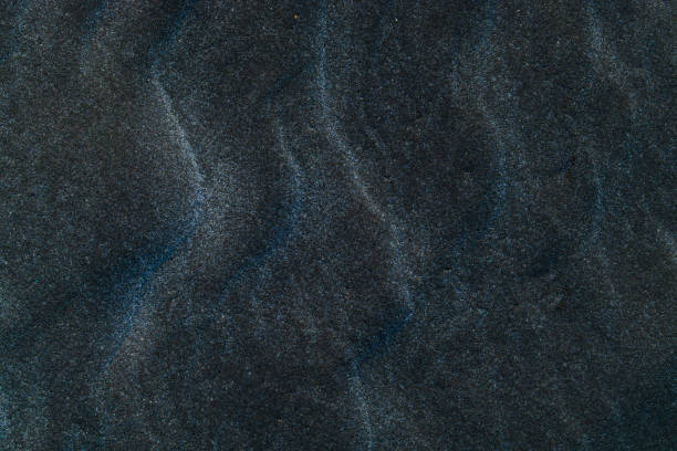 istock Background, texture, wave pattern of oceanic sand on the beach, pastel 872054012