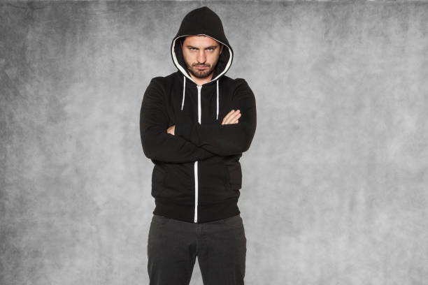 istock The hooligan, dressed in black, is very confident 872057680