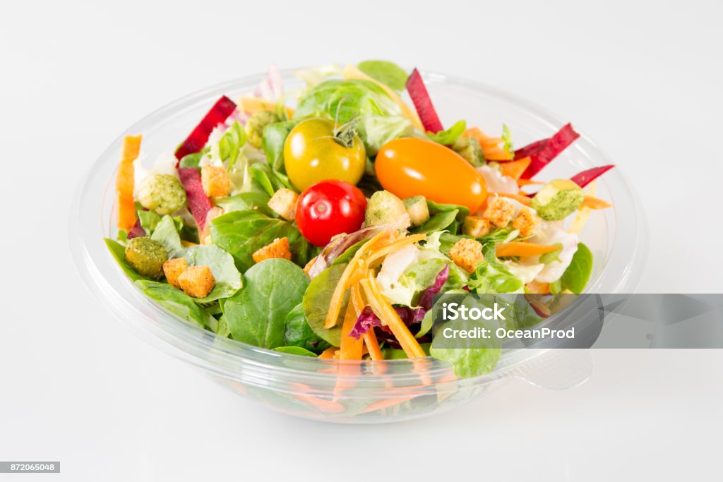 Close up of take away bowl with fast food salad Takeaway salad on white background Salad Stock Photo