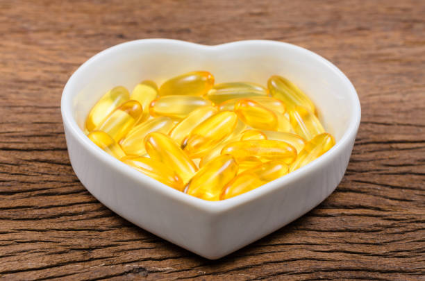 istock fish oil in heart shape bowl 872065236