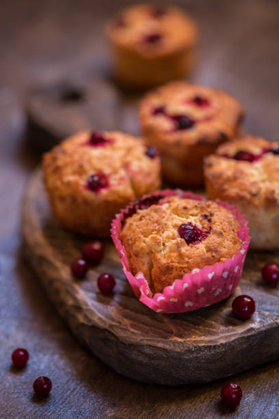 istock muffins with cranberry on wooden background 872066028