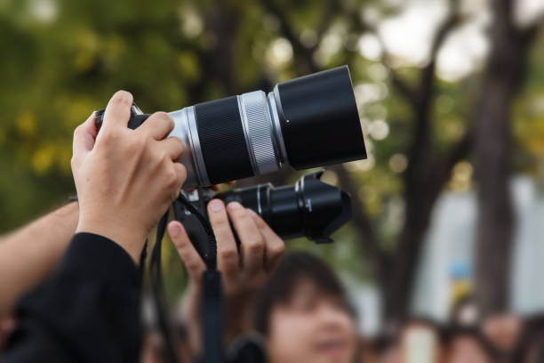 istock Hand with digital camera of taking photo picture 872077702
