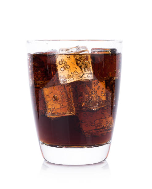 istock Cola in glass with ice cubes on white background 872078744