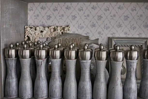 Photo of Vintage salt and pepper shakers with Reserved table in a vintage cabinet in an old restaurant