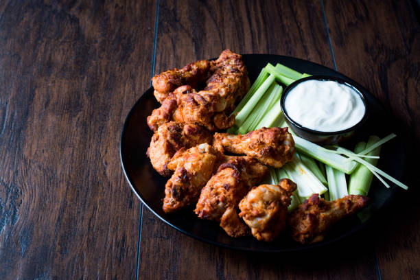 istock Buffalo Wings with Dip Sauce and Leek 872104846