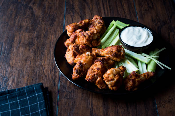 istock Buffalo Wings with Dip Sauce and Leek 872104856