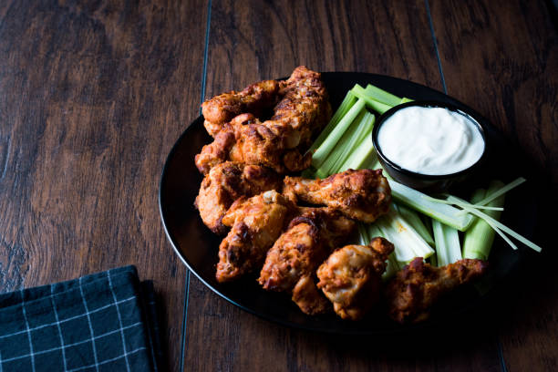 istock Buffalo Wings with Dip Sauce and Leek 872104862