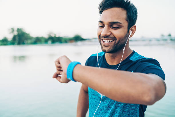 istock Young sportsman with smart watch 872104920